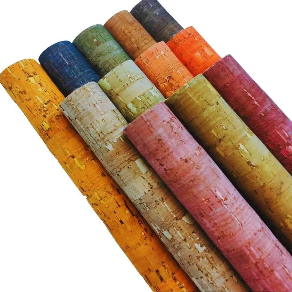 A collection of colorful cork fabric rolls, showcasing the unique texture and water-resistant qualities.