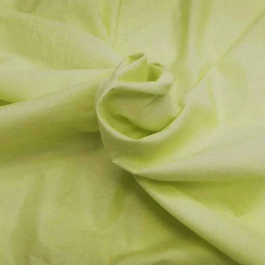 Light yellow soy fabric neatly rolled, showcasing its smooth texture and eco-friendly qualities.