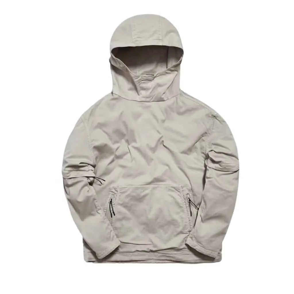 Light gray convertible hoodie with a front pocket and adjustable features, displayed from the front.