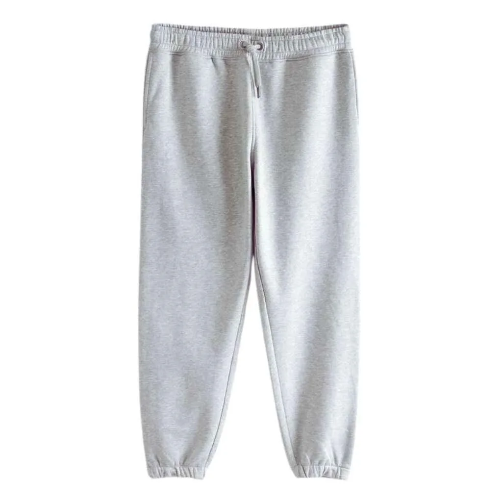 Tapered joggers for men offering a relaxed fit at the top, narrowing towards the ankle, blending comfort with style.