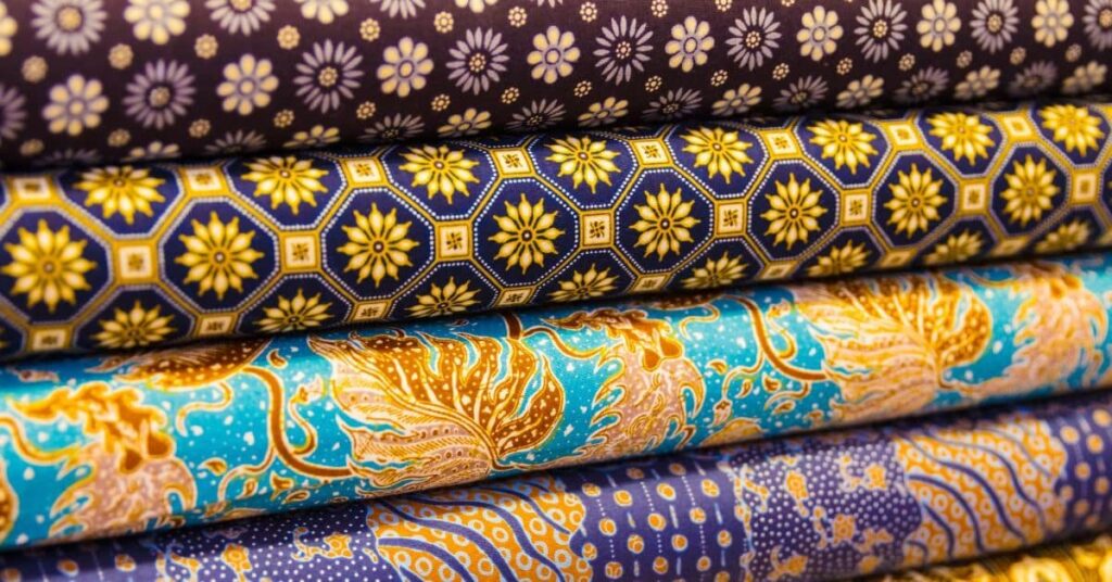 Bundles of Batik fabric in different color and designs.