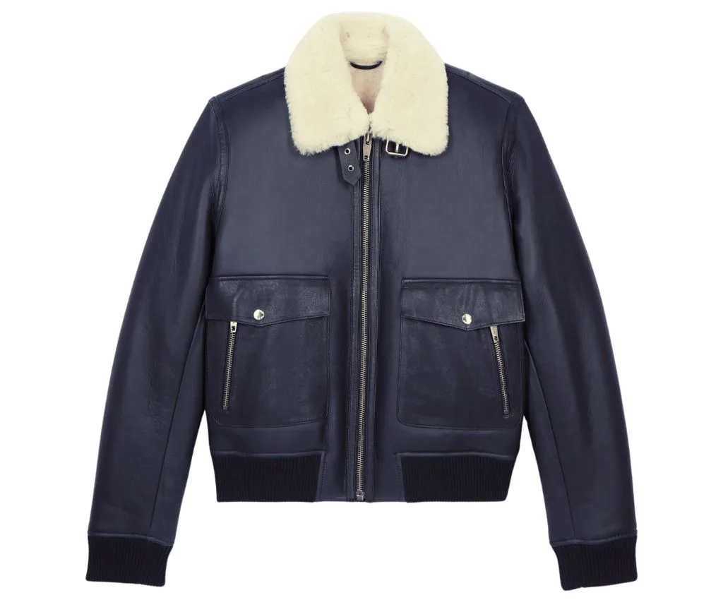 Stylish Navy Shearling Jacket with Fur Collar for Ultimate Comfort and Style Elegant navy shearling jacket with a fur collar and zippered front.