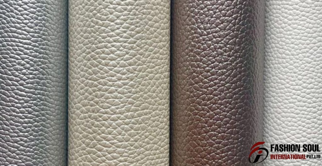 A close-up of four rolls of textured leather-like material in silver, light beige, dark brown, and white. Polyurethane Leather