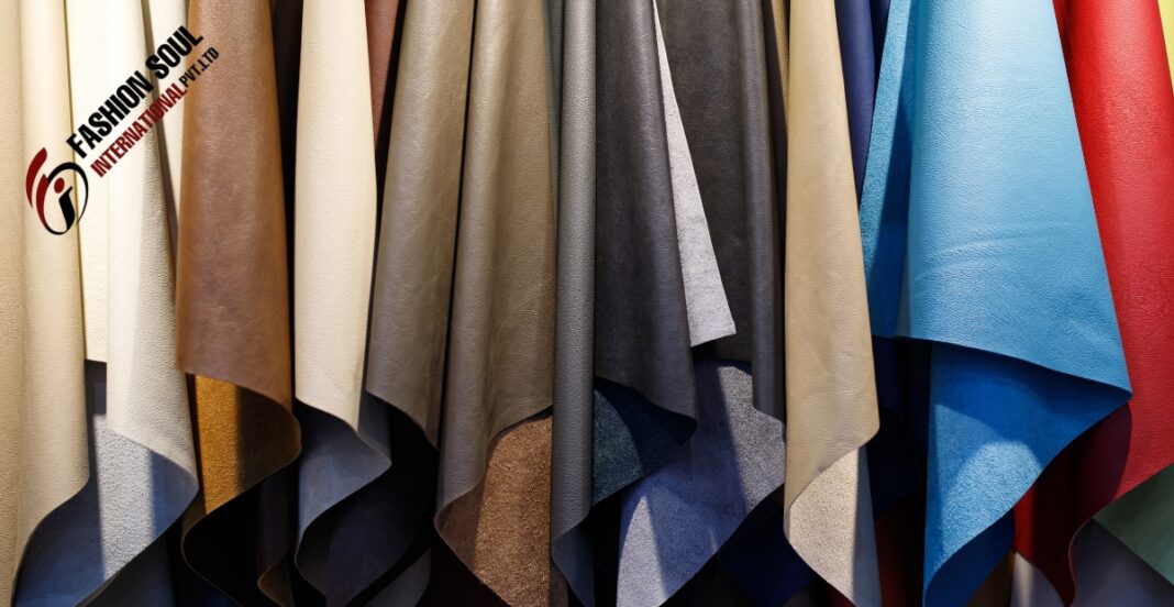 Various colors of aniline leather swatches hanging on display.