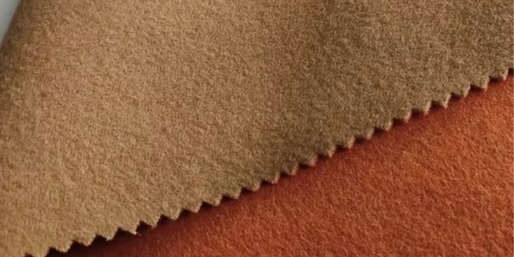 Soft and warm camel wool fabric, showcasing its natural texture and luxurious appeal, ideal for comfort and style.