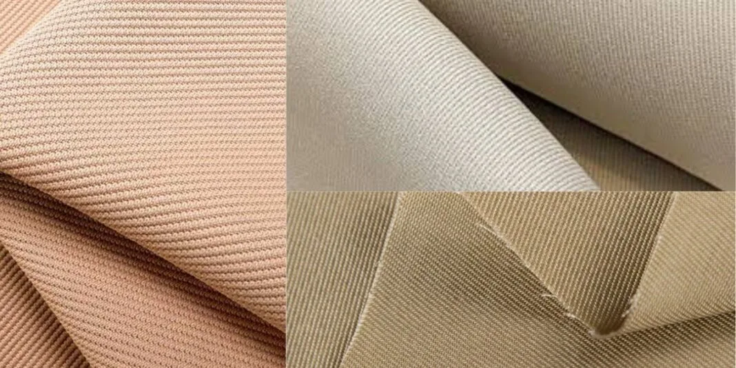 A close-up view of twill fabric, showcasing its distinctive diagonal weave pattern and smooth texture.