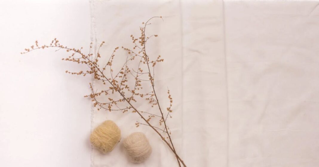Soft soy fabric with natural fibers and dried plant decoration, showcasing eco-friendly textile innovation.