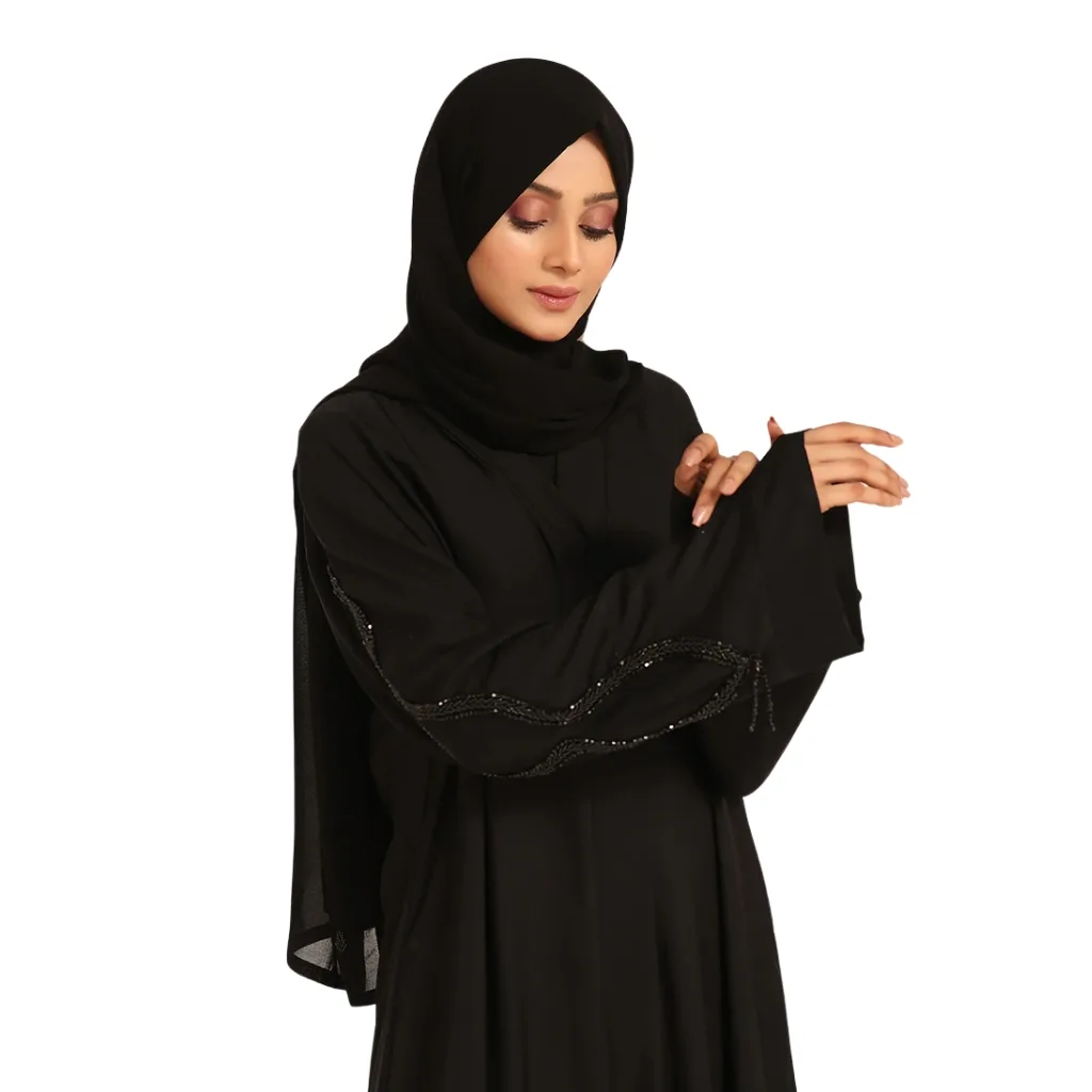 A classic black abaya elegantly draped on a mannequin, showcasing its flowing silhouette and intricate embroidery.