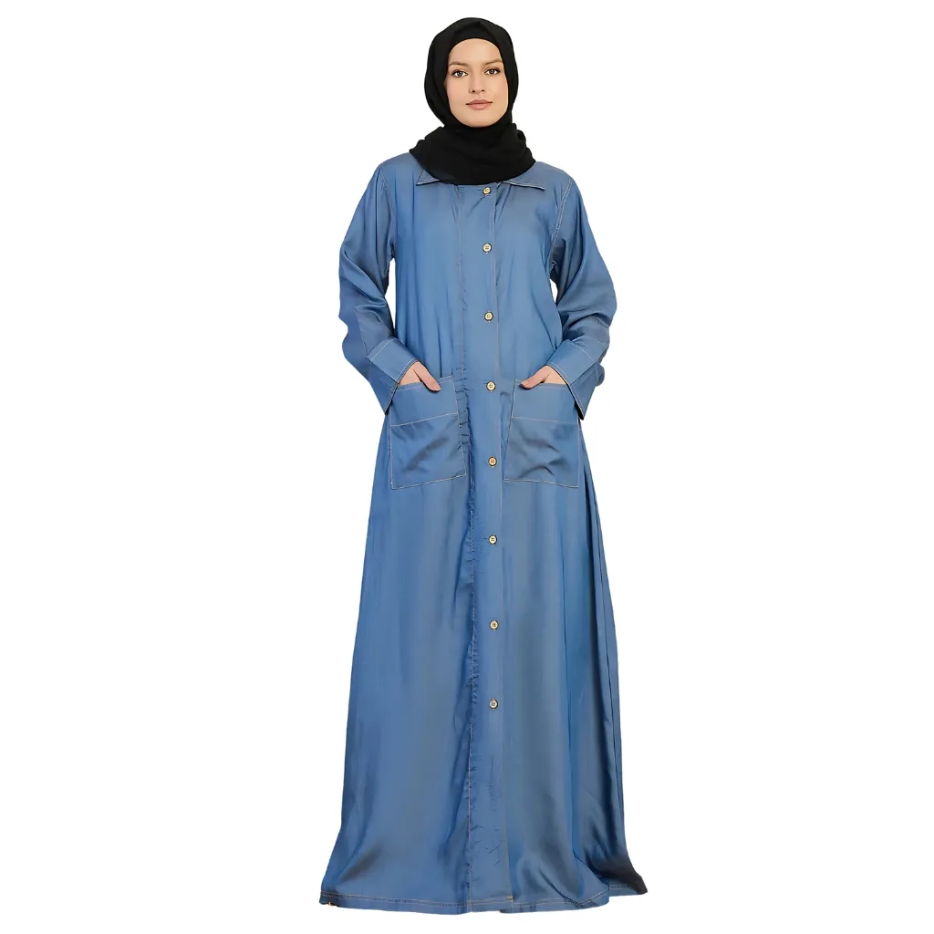 "Chic denim abaya featuring a relaxed fit, stylish pockets, and unique stitching details, perfect for a casual yet trendy look."