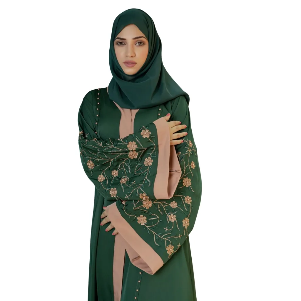 An embroidered abaya displayed on a hanger, featuring intricate floral patterns and shimmering sequins against a soft fabric backdrop.