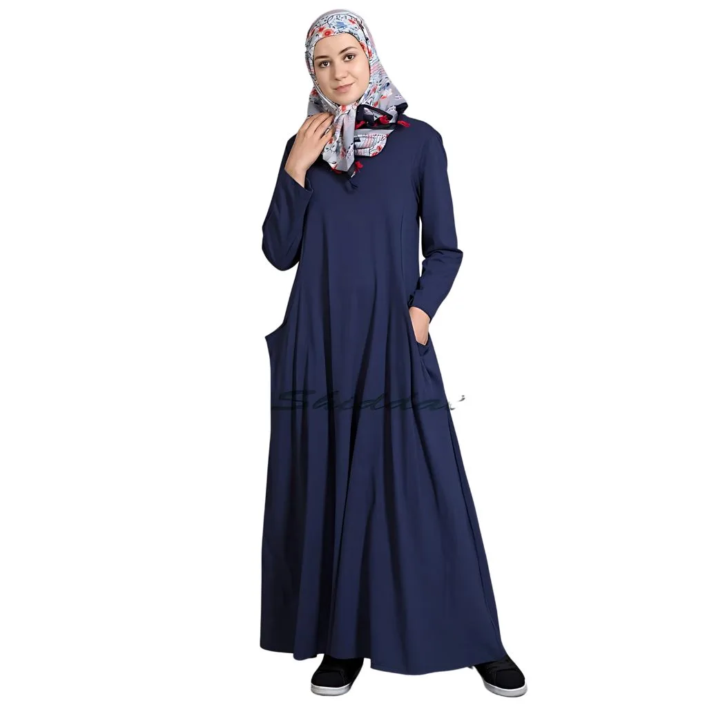 "Crinkle-free travel-friendly abaya made from lightweight fabric, featuring a relaxed fit and practical pockets for convenience."