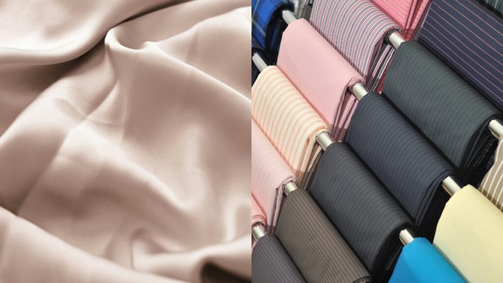 A large swath of smooth, pale pink satin fabric draped on the left, contrasted by neatly rolled spools of assorted fabric samples in various colors and patterns on the right.