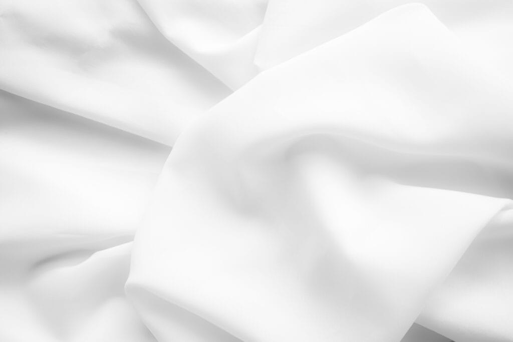 Close-up of a wrinkled bulk of white fabric.