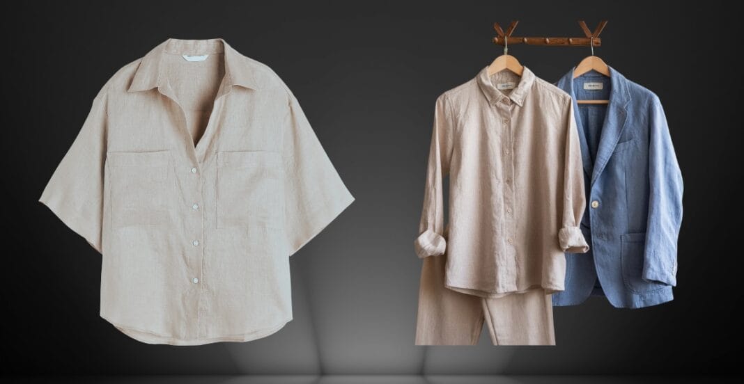 A collection of three linen clothing pieces: a beige short-sleeve button-up shirt hanging on a wall, and a cream-colored long-sleeve shirt along with a blue blazer hanging on a wooden rack against a dark background.