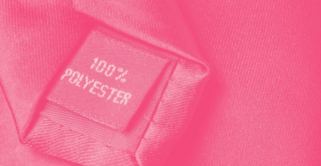 Close-up of a pink fabric label reading 