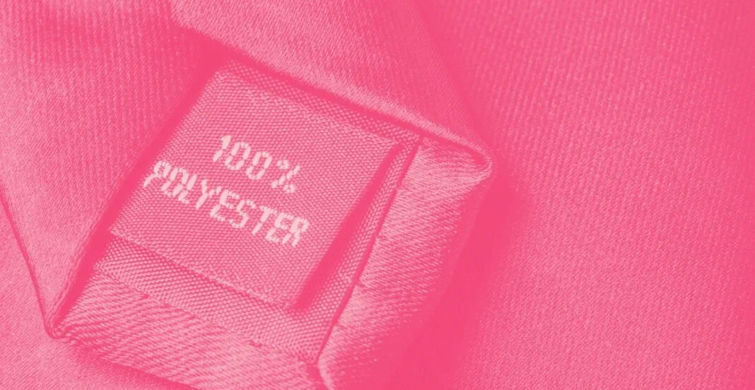 Close-up of a pink fabric label reading 