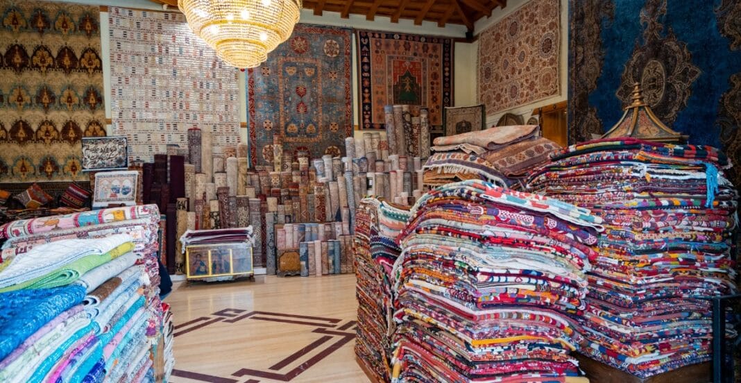 Cozy quilt shop interior showcasing vintage fabric patterns and modern quilting materials neatly displayed on shelves.