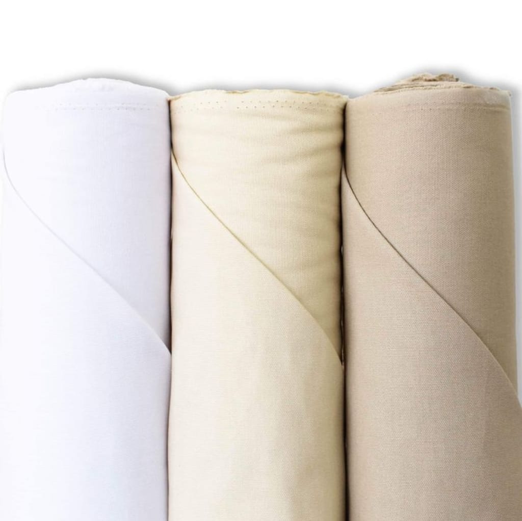 Three rolls of fabric lined up side by side, showing white, cream, and beige colors, made of cotton material.