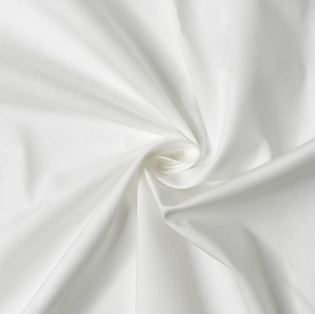A close-up image of smooth, white cotton fabric arranged in a soft, swirling pattern, showcasing its silky texture.