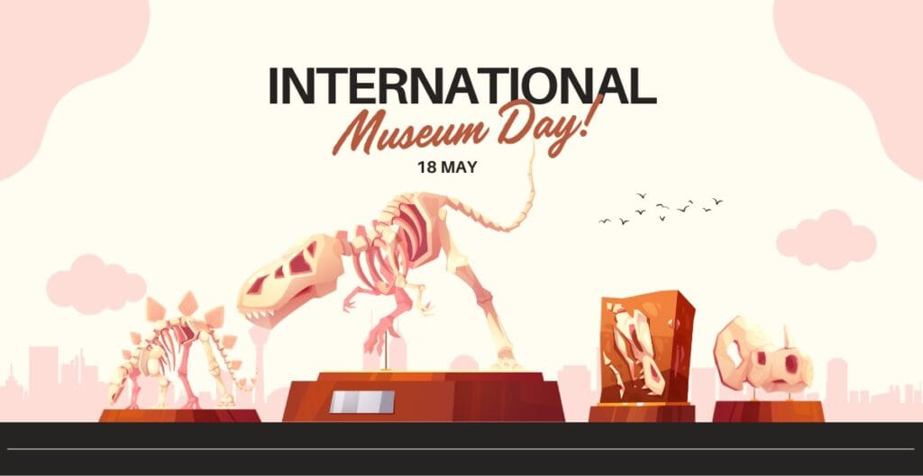 An illustration of four dinosaur skeletons displayed on pedestals in a museum setting, with text above announcing "International Museum Day! 18 May." The background shows a city skyline with clouds and birds.