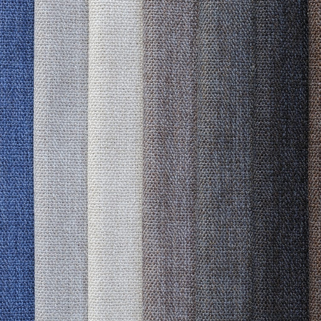 Patterned fabric swatches featuring various colors and textures, including blue, cream, gray, and brown.