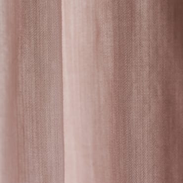 Pale pink polyester-linen blend fabric with a smooth, slightly textured surface, hanging in soft folds.