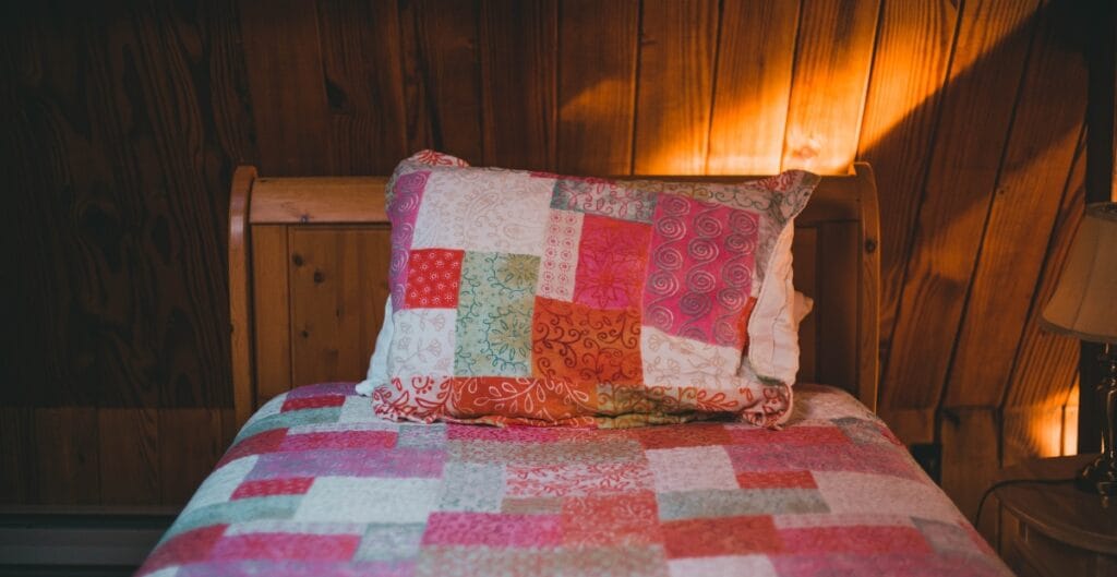 Friendly quilt stores nearby showcasing colorful fabrics, handmade quilts, and cozy community creativity in action.