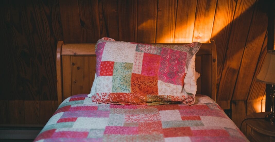 Friendly quilt stores nearby showcasing colorful fabrics, handmade quilts, and cozy community creativity in action.