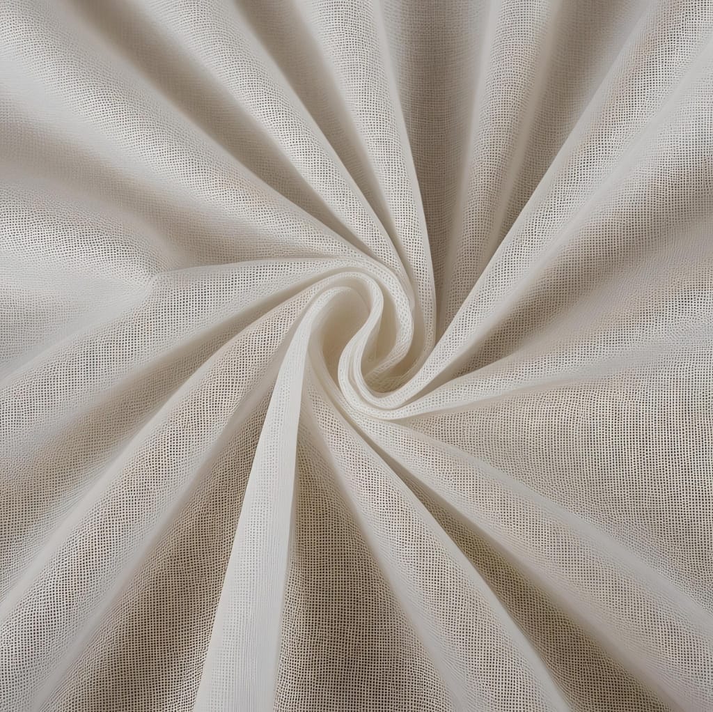 A close-up image of lightweight, semi-transparent cotton voile fabric with a soft, smooth texture, gently twisted in a spiral.