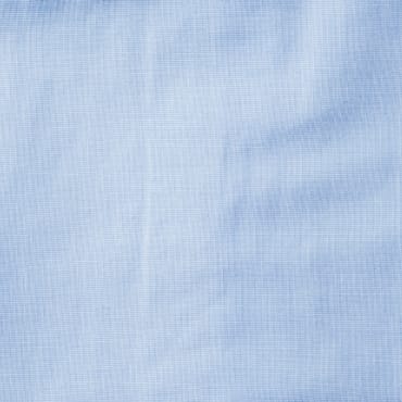 Light blue chambray fabric with a subtle weave pattern.