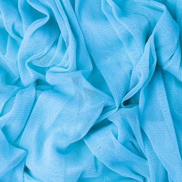 Close-up of breathable light blue polyester mesh fabric with a soft, airy texture.