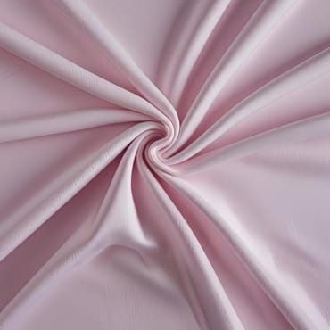 Close-up image of soft, pink polyester jersey fabric with gentle folds.