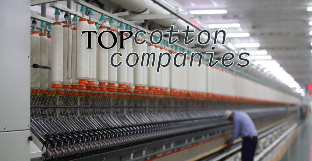 An industrial textile manufacturing environment with yarn spindles and a worker operating machinery, overlaid with the text "Top Cotton Companies."