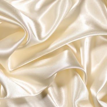A close-up image showing a fabric with a smooth, shiny surface that combines the textures of polyester and silk.