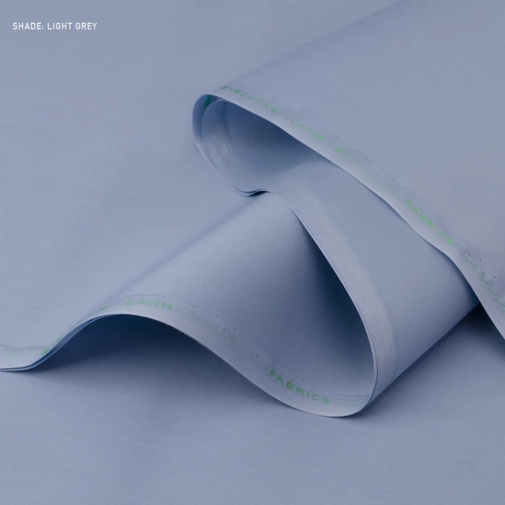 A close-up of light grey fabric with a smooth, slightly folded texture.