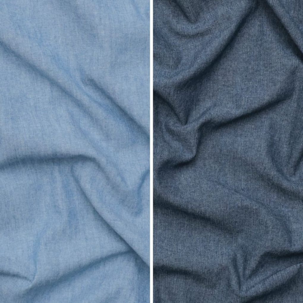 Close-up image showing two different types of denim fabric. The left side features lighter denim chambray, and the right side shows darker, more textured denim fabric, both with a wrinkled appearance.