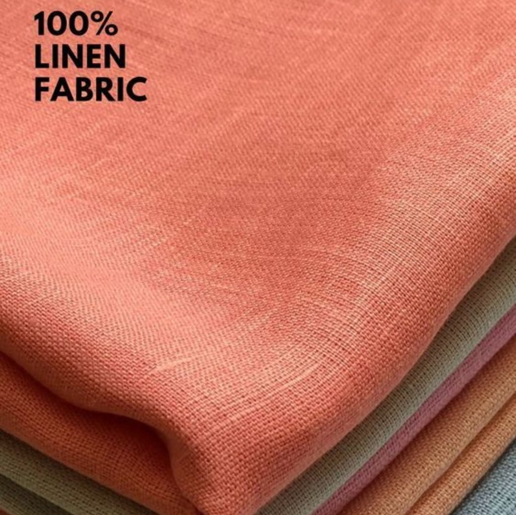 A close-up image of folded beige and pink linen fabric sheets with the text "100% Linen Fabric" in the top left corner.
