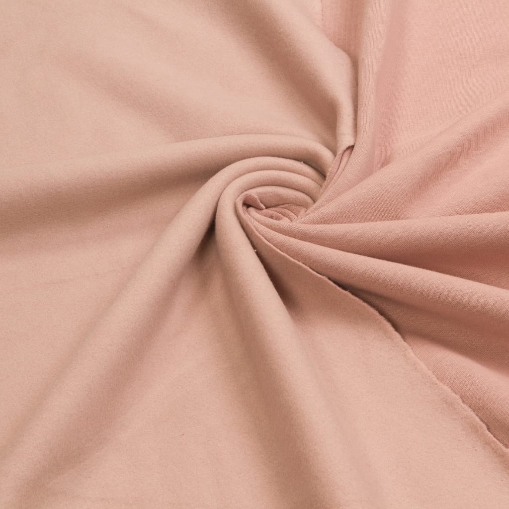 Close-up of combed cotton fabric showing its smooth, uniform weave and soft texture.
