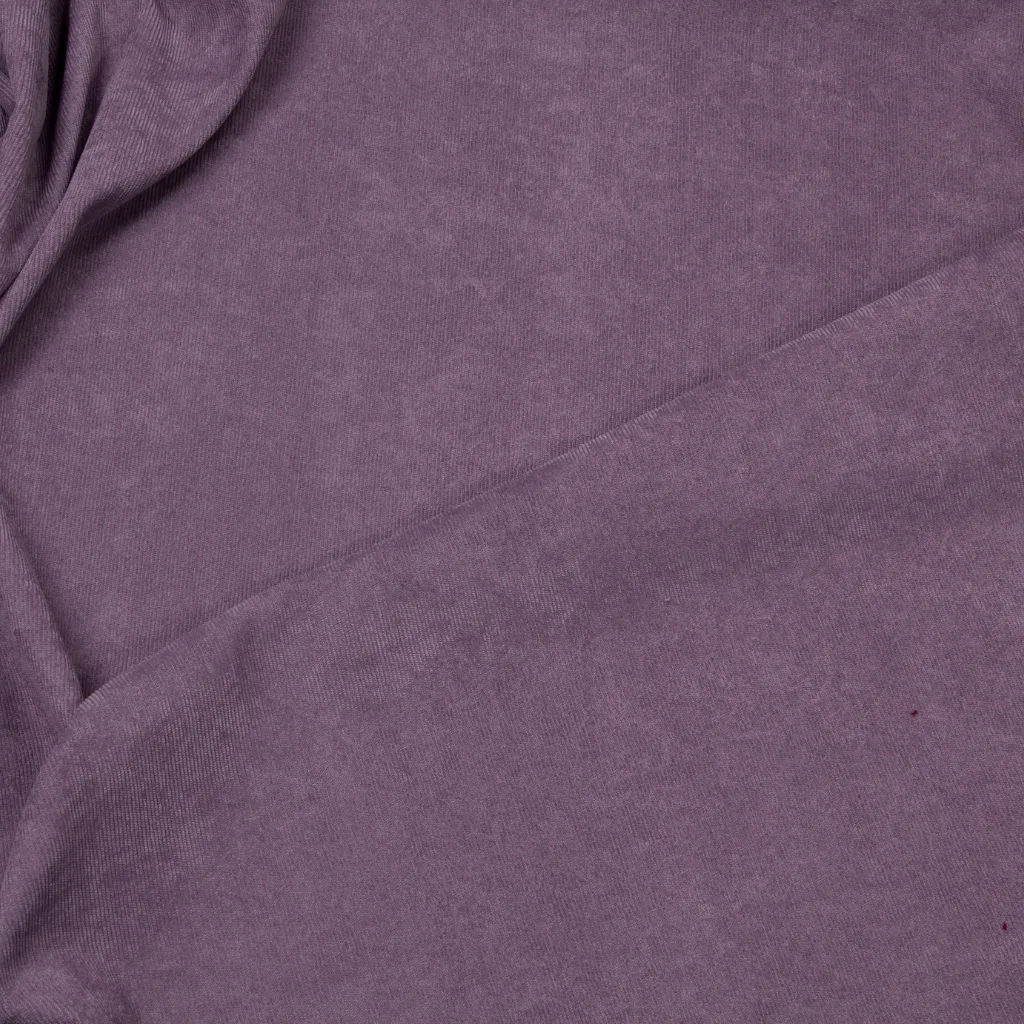 Close-up of purple corduroy fabric showing smooth, fine-wale texture.