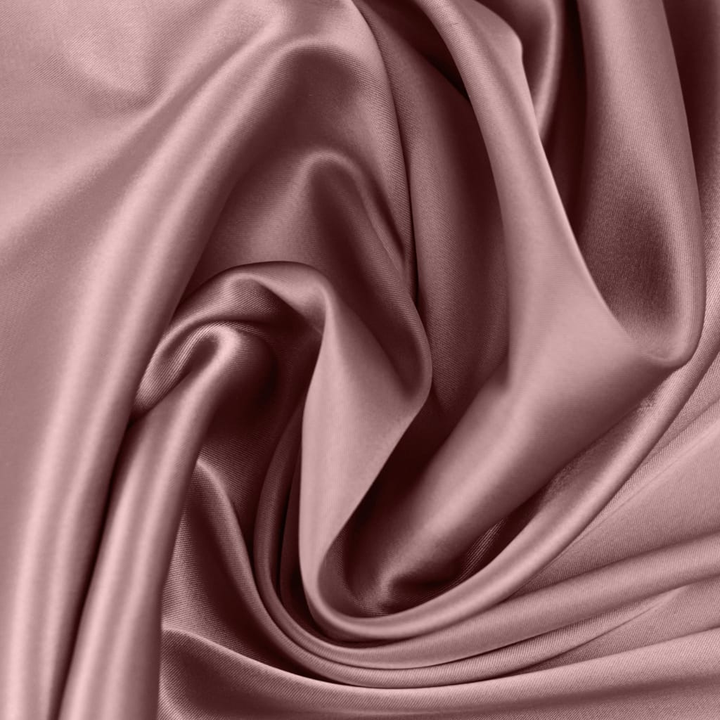 Close-up image of soft, shiny, pink satin chiffon fabric with smooth, flowing folds.