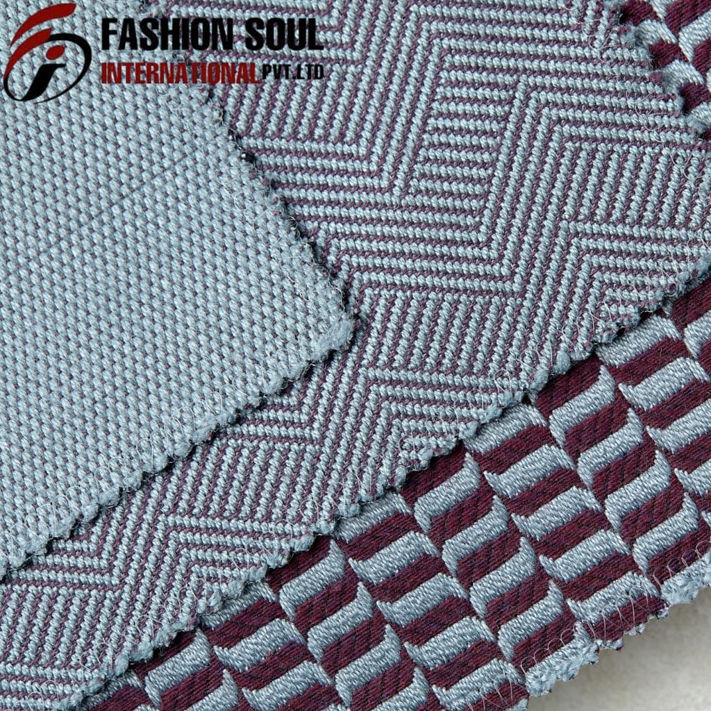 Close-up of a textured fabric sample with two different patterns; the top pattern has a geometric design with fine lines and a pinkish hue, while the bottom pattern features a repeating striped design in similar colors. The image also includes a logo in the top left corner that reads "Fashion Soul International Pvt Ltd."