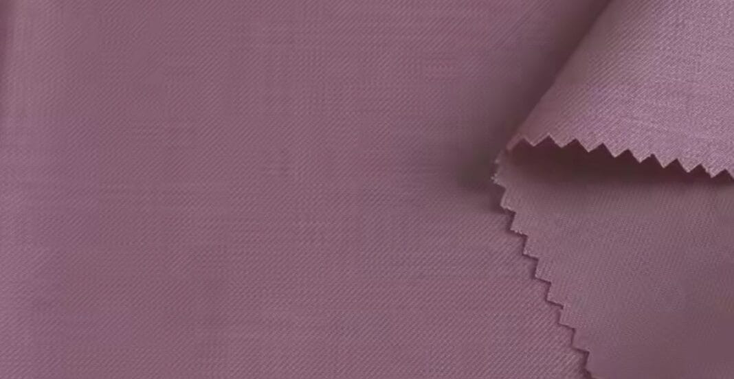 Close-up of mauve-colored fabric swatches with a zigzag-cut edge