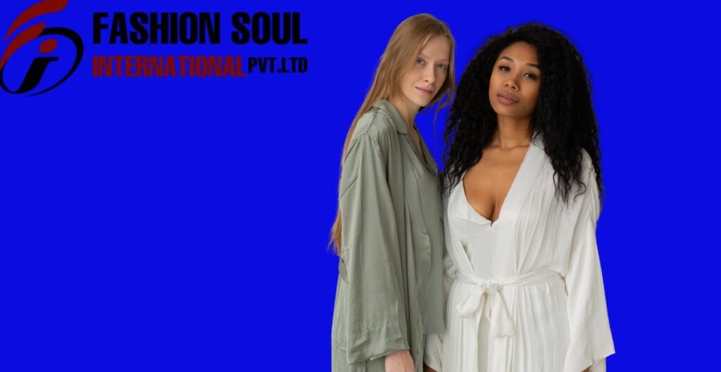 Two women standing side by side in front of a bright blue background with the "Fashion Soul International Pvt. Ltd" logo in the top left corner.