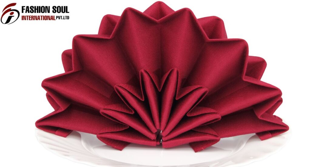 polyester-napkins-for-wedding Elegant wedding table setting featuring folded polyester and linen napkins side by side for comparison.