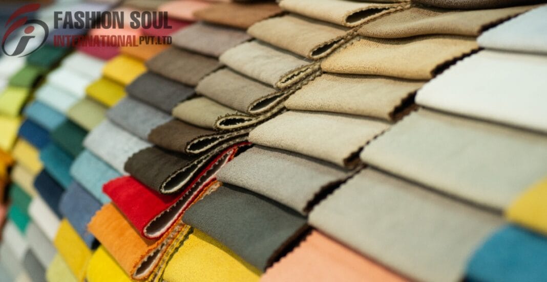 Colorful fabric swatches arranged in neat rows, showcasing a variety of shades from neutrals to vibrant colors.