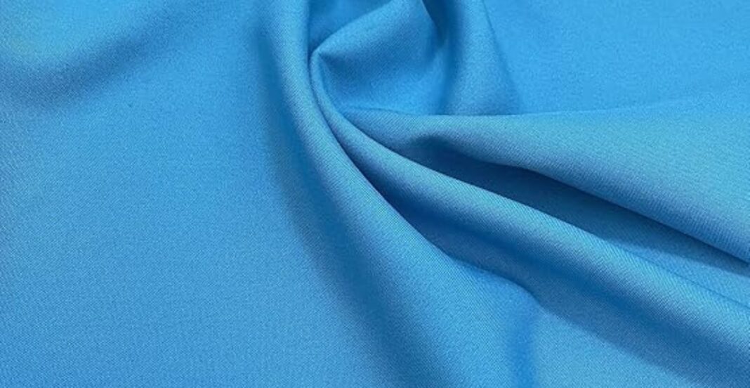 Smooth, sky blue satin fabric with soft folds and a subtle sheen.