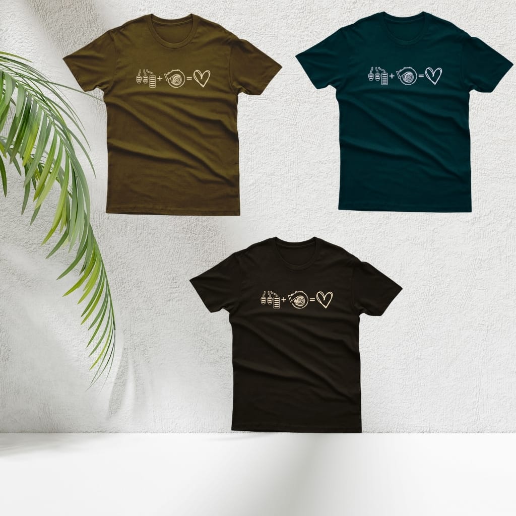 Three T-shirts displayed against a white textured wall with a green plant leaf on the left. The T-shirts are in olive green, dark teal, and black, each featuring a white printed design that includes bottles, a frying pan, and a heart.