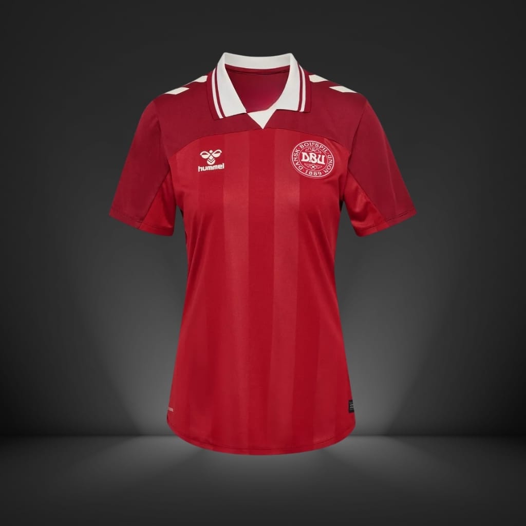 Red short-sleeved sports jersey with white collar and DBU logo on a dark studio background.