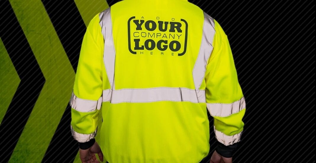 A person wearing a bright yellow high-visibility safety jacket with reflective silver stripes. The jacket features a placeholder area for a company logo on the back, with the text 
