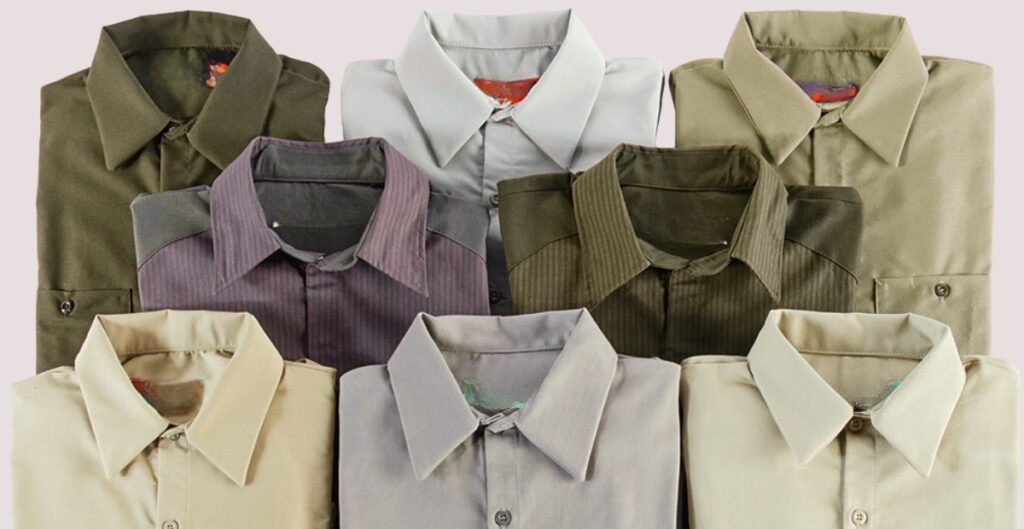 A neatly pressed long-sleeve button-up shirt hanging on a hanger, ready for care instructions.